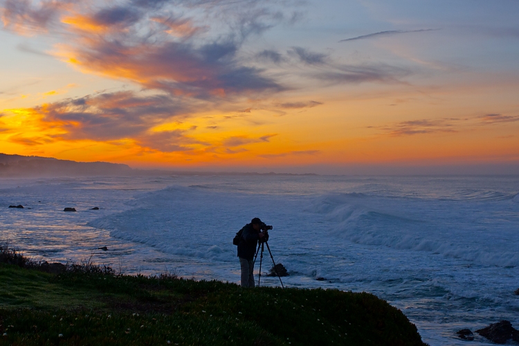 Photographer at beach sunrise